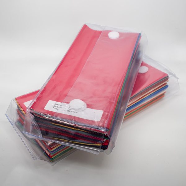 A neat stack of bundle of 120 of direct colour drapes wrapped for delivery