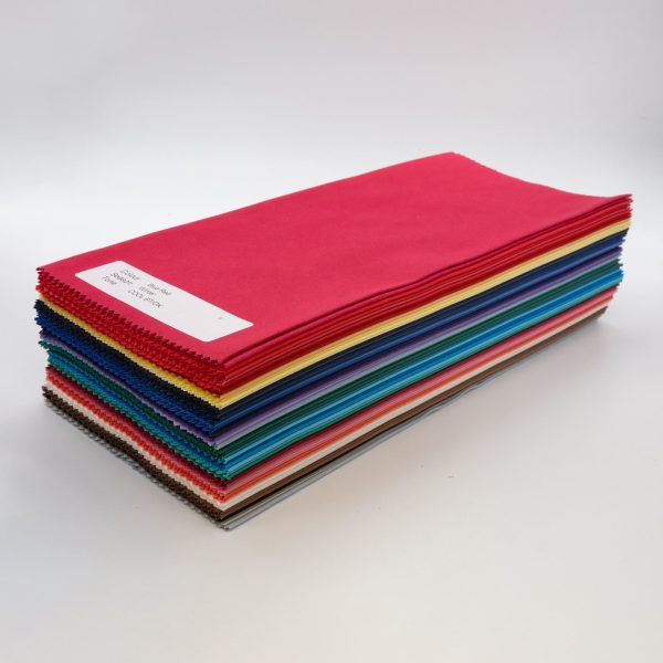 A neat stack of bundle of 60 of direct colour drapes, diagonal full image from side