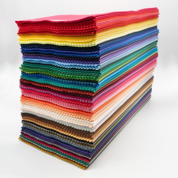 A neat stack of all colours of direct colour drapes, diagonal full image