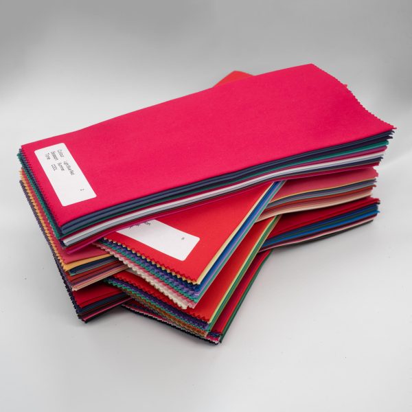 Crossways stack of all colours of direct colour drapes, full image